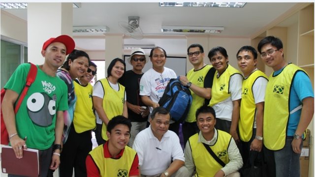 Barangay captain receiving  a sample 72 hr kit