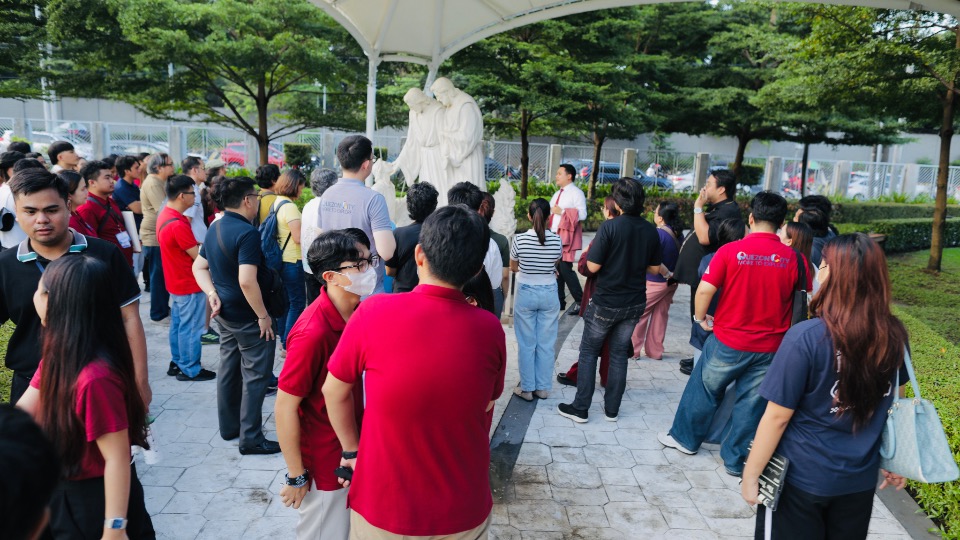 Participants of the “QC More to Explore: Lakbay-Saysay Kasama si Prof. Xiao, Christianity Tour Edition” view the First Vision sculpture on September 30, 2026 as the final stop of a daylong educational tour of Christian sites in Quezon City.